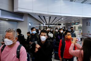Passengers arrive at West Kowloon High-Speed Train Station Terminus on the first day of the resumption of rail service to mainland China, during the coronavirus disease (COVID-19) pandemic in Hong Kong