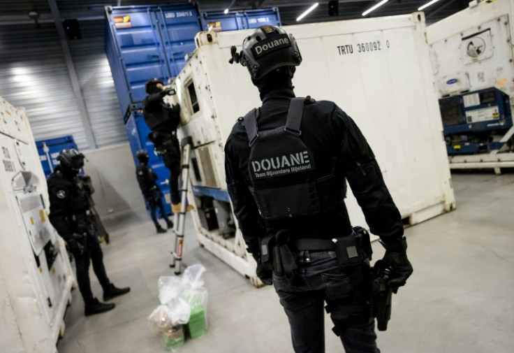 Armed members of Dutch customs carry out a check on a container at the port of  Rotterdam, Europe's largest