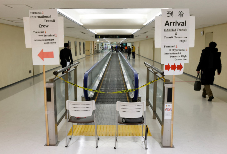 Passenger of a plane from Dalian in China, heads to the coronavirus disease (COVID-19) test area, upon his arrival at Narita international airport
