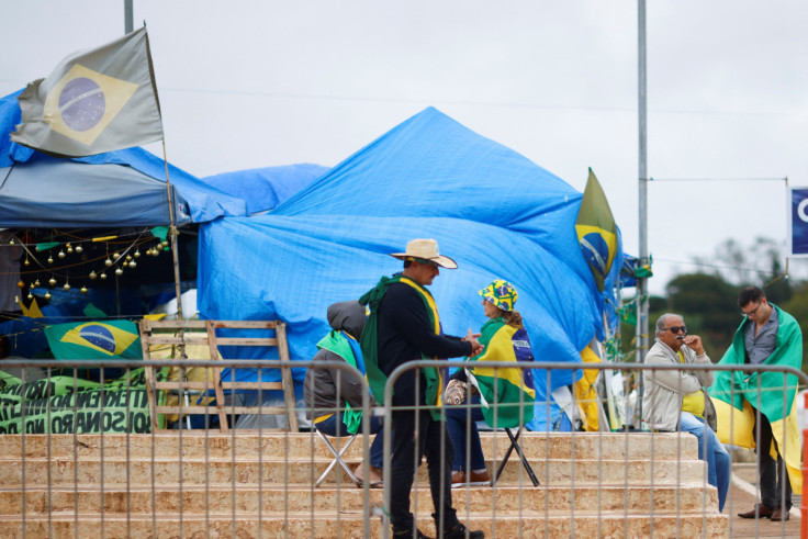 Supporters of of Brazil's President Jair Bolsonaro are seen at a camp during a protest against President-elect Luiz Inacio Lula da Silva at the Army Headquarters in Brasilia