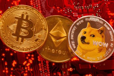Representations of cryptocurrencies Bitcoin, Ethereum and DogeCoin are placed on PC motherboard in this illustration taken