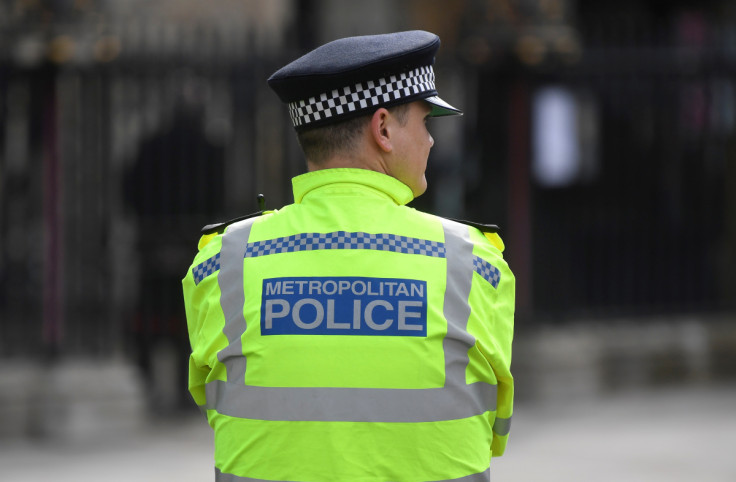 A Metropolitan Police officer stands on duty in London