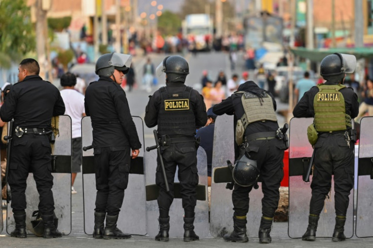 Police blocking the road in Humay, Peru, preventing indigenous people from the Chanka ethnicity from continuing on their journey to Lima for a mass anti-government protest