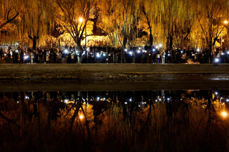 Vigil commemorating victims of a fire in Urumqi, in Beijing