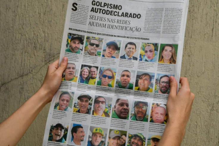 A page from the Brazilian newspaper O Globo featuring the faces of rioters who stormed key buildings in the capital Brasilia  on January 8 2023