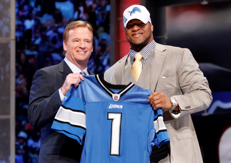 Ndamukong Suh of the University of Nebraska (R) stands with NFL commissioner Roger Goodell in New York