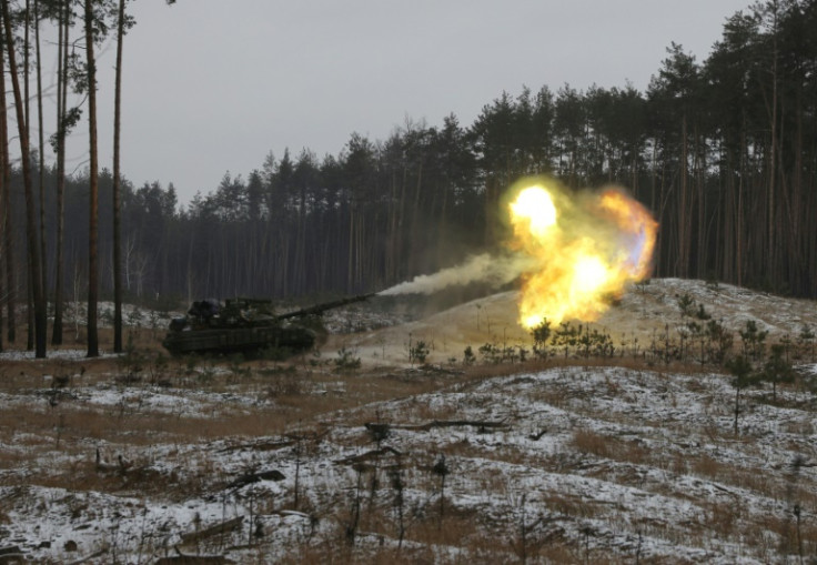 A Ukrainian tank fires at Russian positions in the eastern Lugansk region