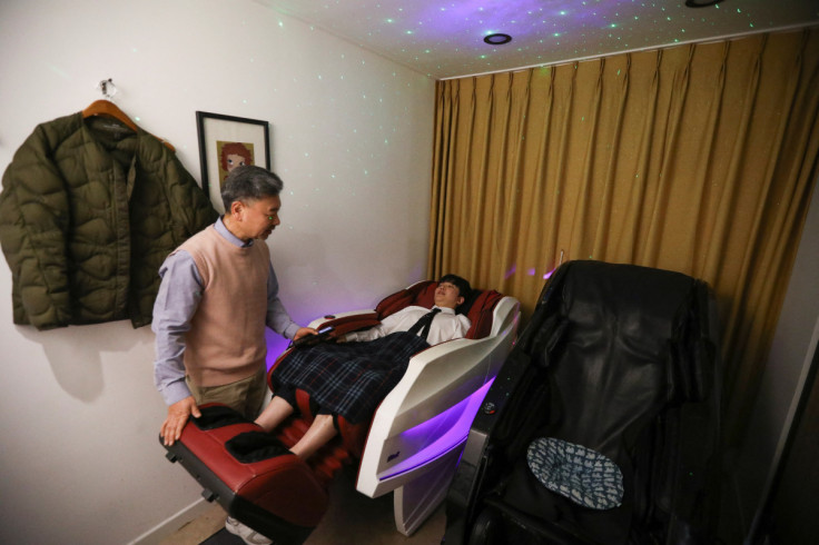 Cafe owner Ma Seung-deok takes care of a customer at a healing sleep cafe in Seoul