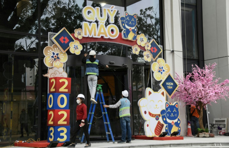 Streets are decked out with statues of felines and shops are selling cat-themed decorations for Vietnamese New Year, known as Tet