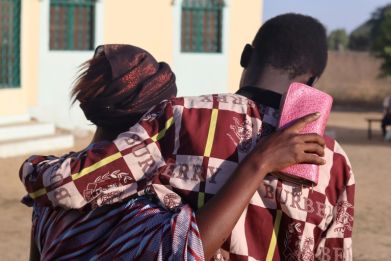 A mother in N'Djamena hugs her son on December 8 after he was released on bail