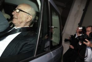 News Corporation CEO Rupert Murdoch is driven away from his flat in central London