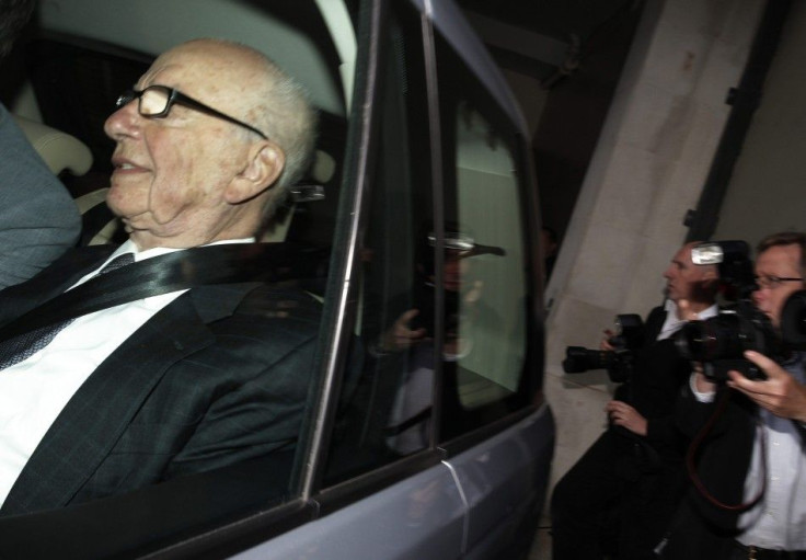 News Corporation CEO Rupert Murdoch is driven away from his flat in central London