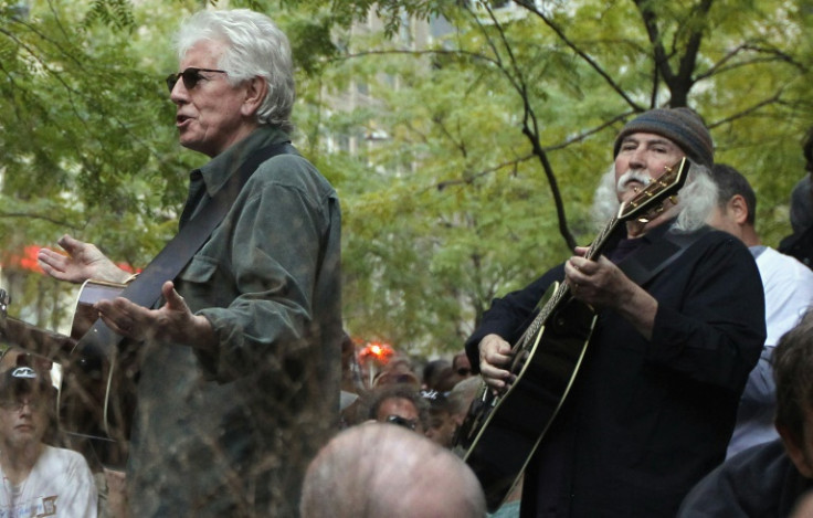 David Crosby (R) was known for his activism -- here, he played with former bandmate Graham Nash (L) for members of Occupy Wall Street in 2011