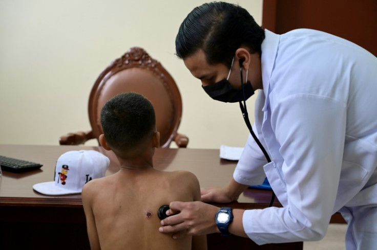 A doctor treats a young drug addict at the Bicentenrio public hospital in Guayaquil