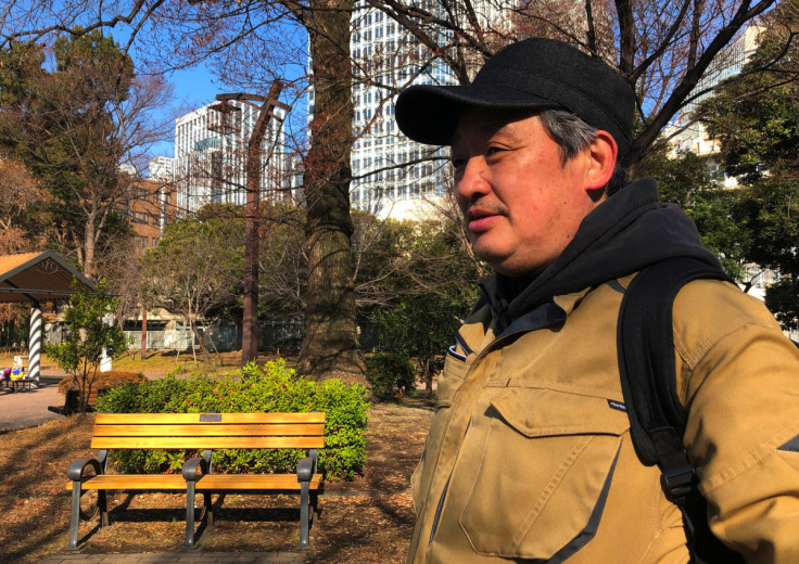 Day labourer Masami Fujino poses for a photo during an interview with Reuters at a park in Tokyo