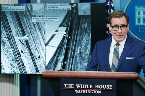 White House National Security spokesman John Kirby displays intelligence photographs of what the US says is a Russian train in North Korea picking up military supplies for the private Wagner military group fighting in Ukraine