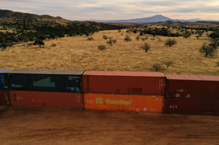 From close up, the double-stacked container wall looks like the clumsy handiwork of a giant playing with building blocks