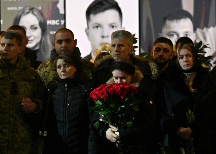 Relatives attend the funeral ceremony of Ukrainian Interior Minister Denys Monastyrsky and other employees of his department in Kyiv