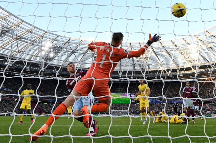 Hammer blow: Jarrod Bowen (centre left) scores one of his two goals against Everton on Saturday