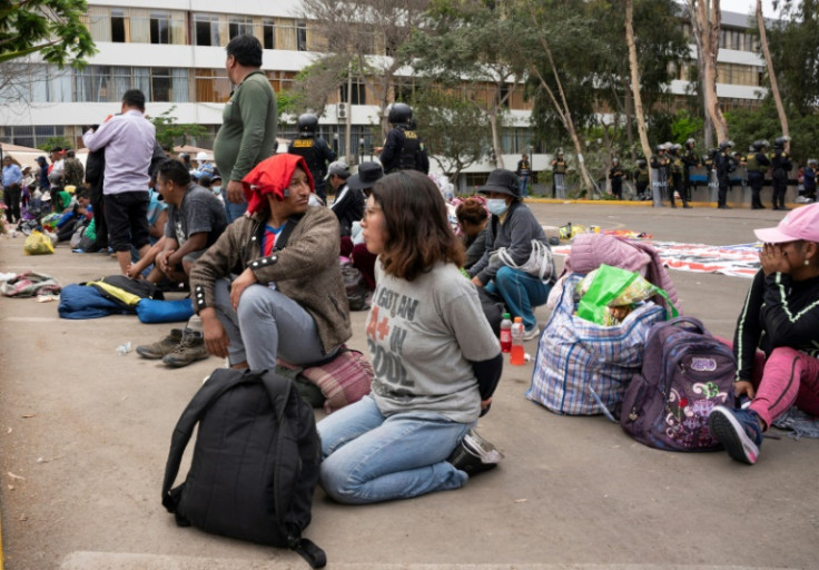 Alleged protesters wait to be transferred after arrest on the University of San Marcos campus in Lima on January 21, 2023