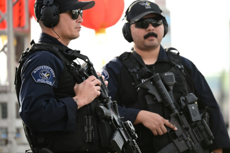 Monterey Park police officers stand at the scene of a mass shooting in Monterey Park, California, on January 22, 2023.