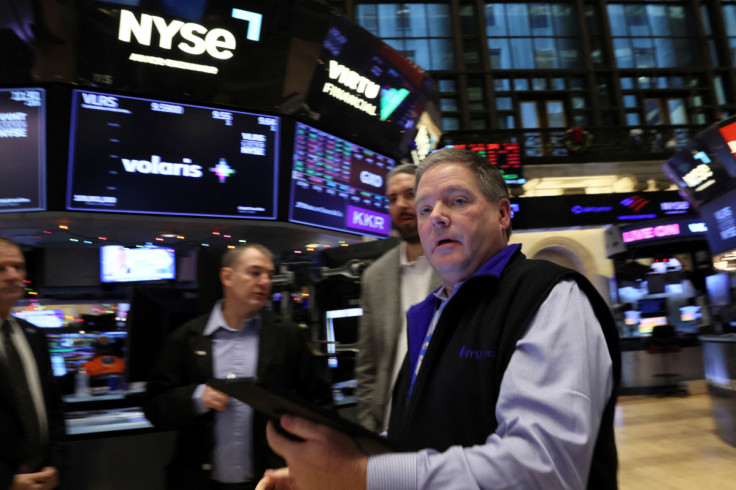 Traders work on the floor of the NYSE in New York