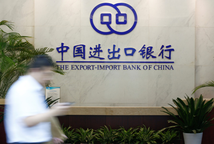 A man walks past the lobby of the Export-Import Bank of China (EXIM) headquarters in Beijing