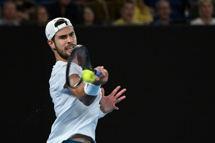 Russia's Karen Khachanov hits a return against Sebastian Korda