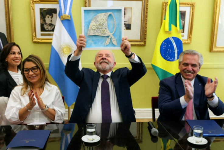 Brazil is back for the regional CELAC summit under President Lula (C, with his wife and Argentine President Alberto Fernandez) after his far-right predecessor Bolsonaro suspended participation