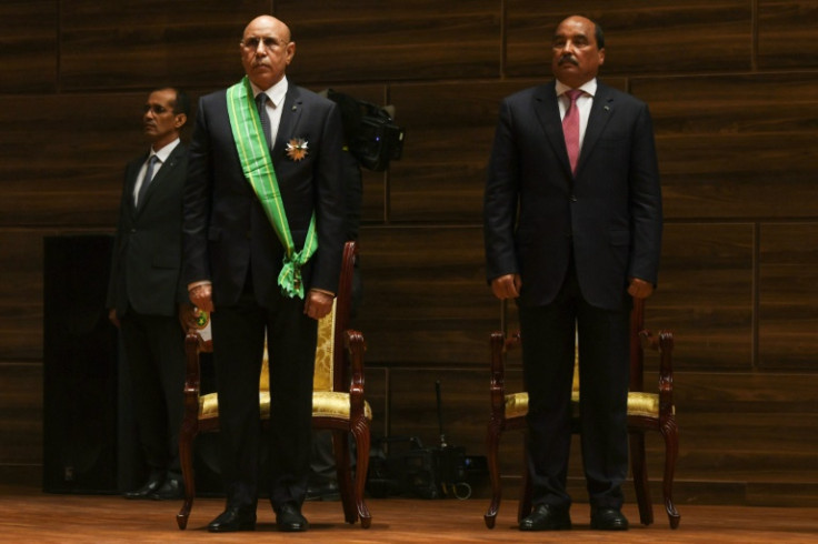Erstwhile friends: Mohamed Ould Ghazouani, left, at his swearing-in as president in August 2019, next to his predecessor Abdel Aziz