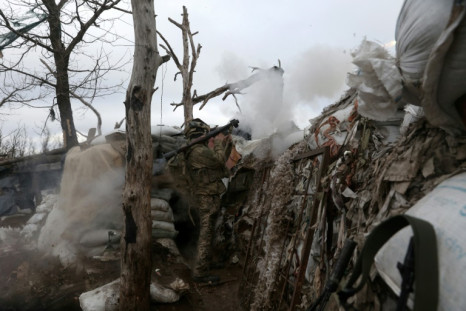 A Ukrainian serviceman fires an RPG towards a Russian position in Donetsk