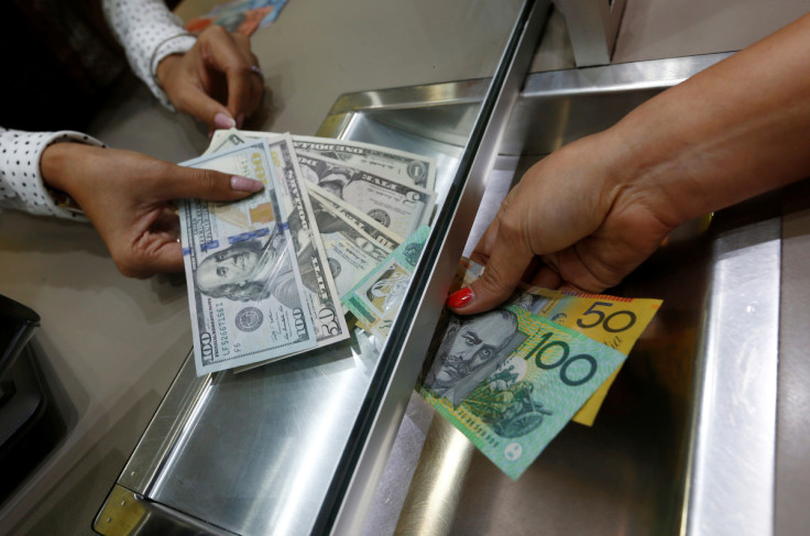 Australian dollar and U.S. dollar denominations are shown in a photo illustration at a currency exchange in Sydney