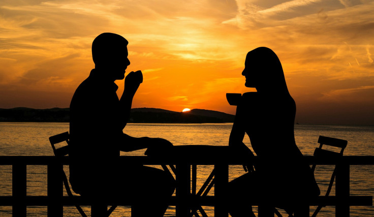 sunset couple coffee sitting table