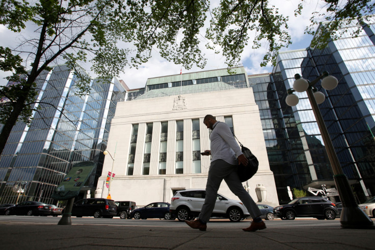 A pedestrian walks past the Bank of Canada building in Ottawa