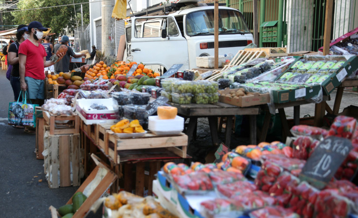 Consumers shop at a weekly street market in Rio de Janeiro