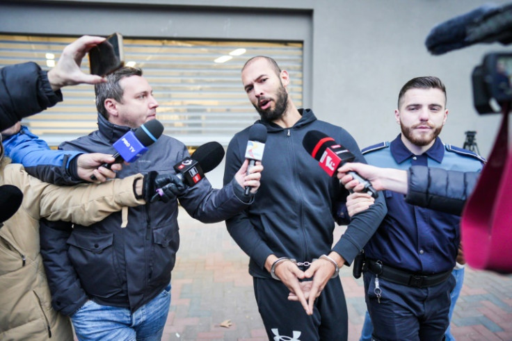 Former kickboxer Tate, his younger brother and two Romanian women are under investigation
