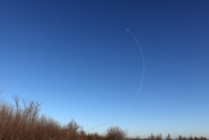An anti-aircraft rocket rises across the sky near Ukraine's Soledar town