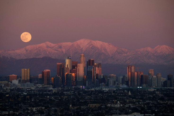 The San Gabriel Mountains loom over the Los Angeles skyline