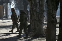 Ukrainian servicemen walk in a street in Bakhmut in the Donetsk region of eastern Ukraine