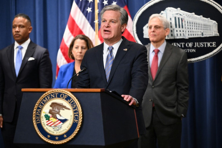 FBI Director Christopher Wray with Deputy Attorney General Lisa Monaco (2L), and US Attorney General Merrick Garland (R), announce an international ransomware enforcement action against Hive on January 26, 2023
