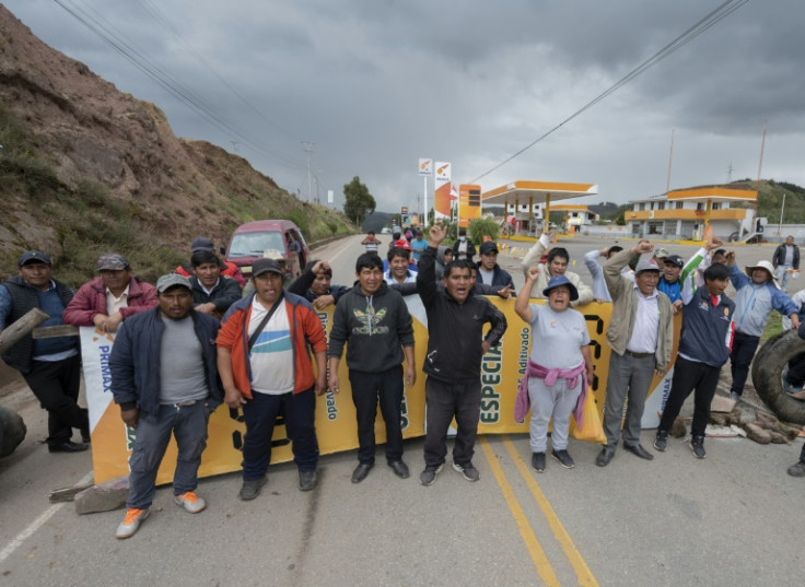 Protesters block a road leading to the Urubamba, Anta and Izuchaca districts of Cusco -- it is one of dozens of roadblocks across Peru as protesters demand the resignation of President Dina Boluarte