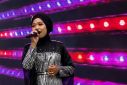 Makhi, a member of the hijab-clad Nasida Ria band, performs at a festival in Jakarta