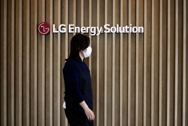An employee walks past the logo of LG Energy Solution at its office building in Seoul