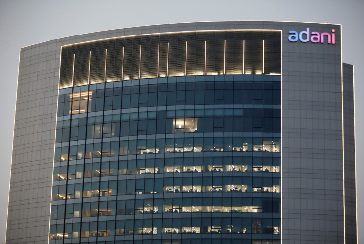 The logo of the Adani Group is seen on the facade of one of its buildings on the outskirts of Ahmedabad