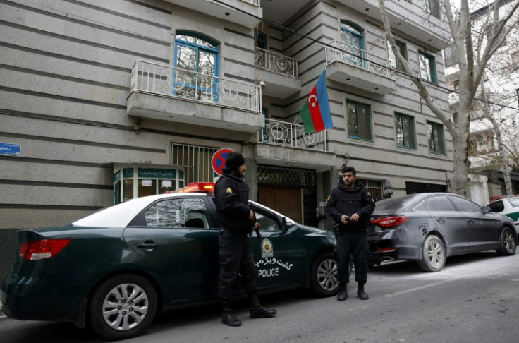 Police stand guard in front of the Azerbaijan embassy in Tehran  following Friday's attack
