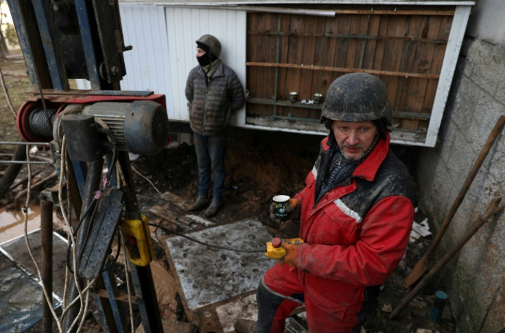 Volunteers drill another well for water