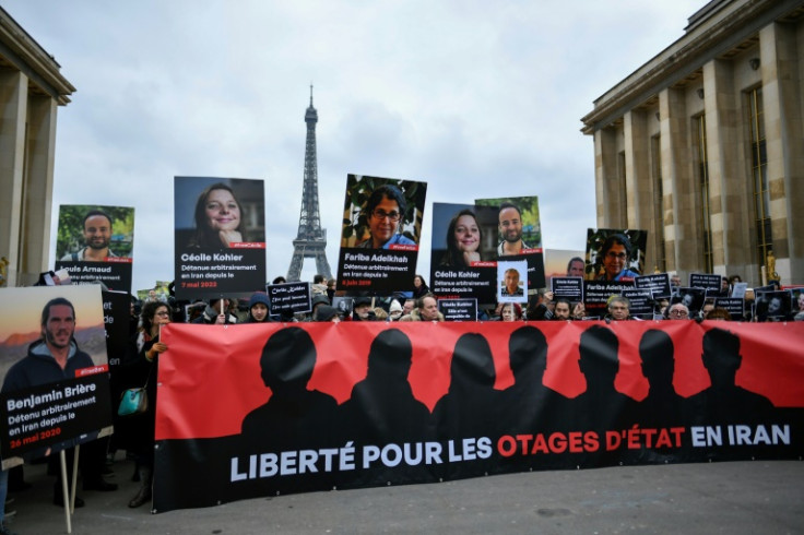 Dozens of people gathered behind a banner calling for 'freedom for the hostages in Iran'