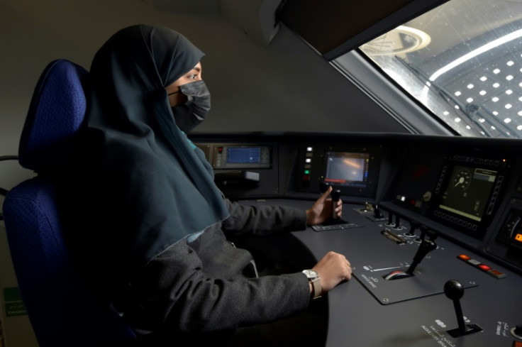 Driver Raneem Azzouz takes her seat at the helm of a high-speed train ferrying pilgrims to Mecca, less than five years after Saudi authorities gave women the right to drive road vehicles