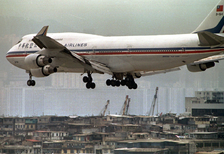 A China Airlines 747-400 prepares to land over buildings at Hong Kong's Kai Tak international airpor..