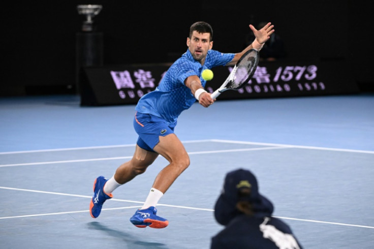 Serbia's Novak Djokovic hits a return against Greece's Stefanos Tsitsipas